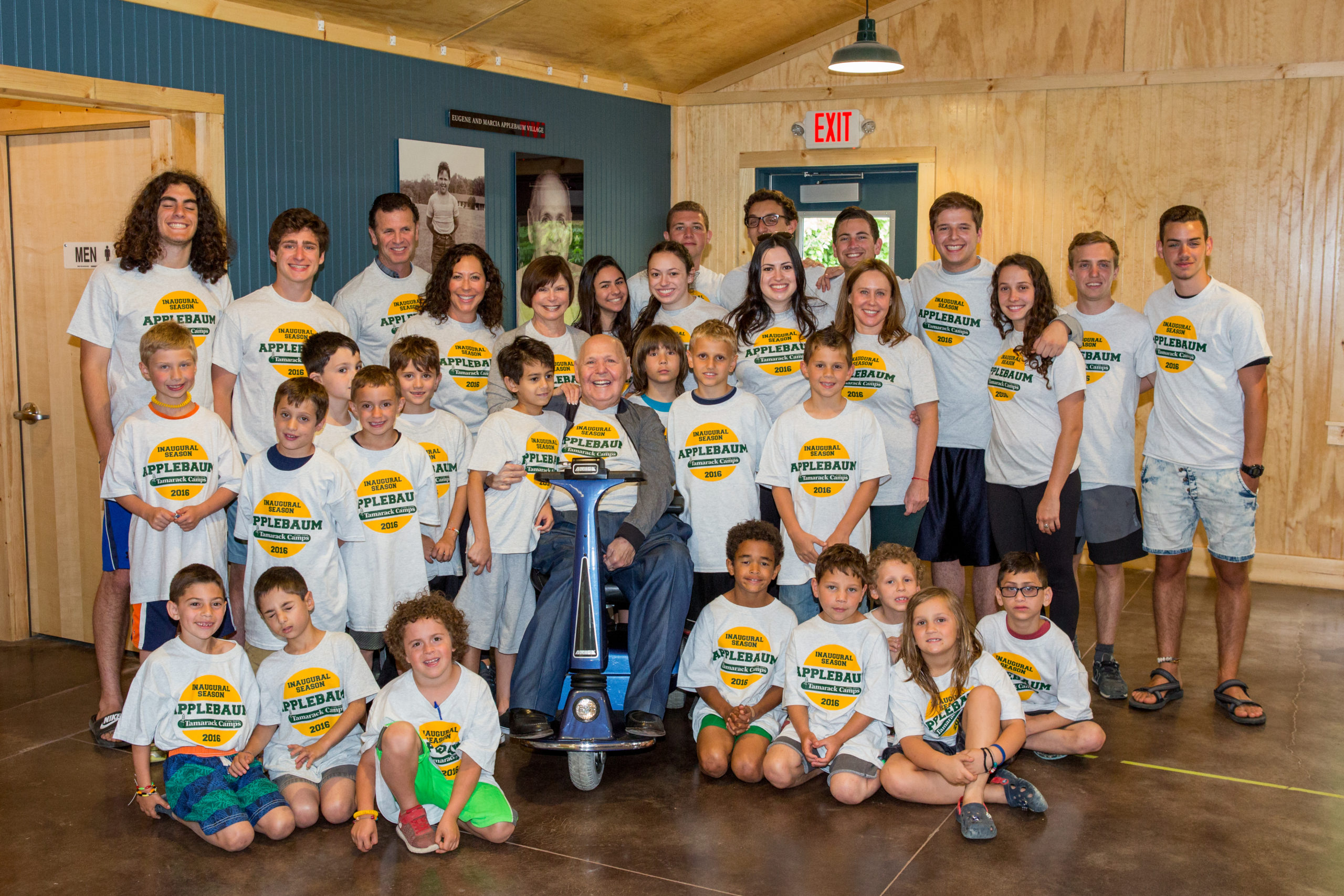 Group gathers with campers at the Eugene Applebaum Dedication at Tamarack Camps, 2016